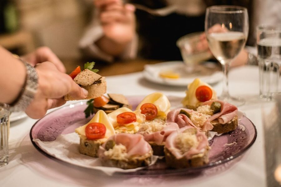 Vienna: Hidden Wine Cellars Tasting Experience - Wine, water, and Viennese food